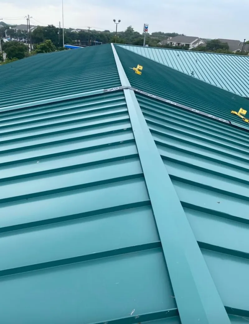 Green commercial metal roof ridge and valley for Metal Roof Repair in South Lakes