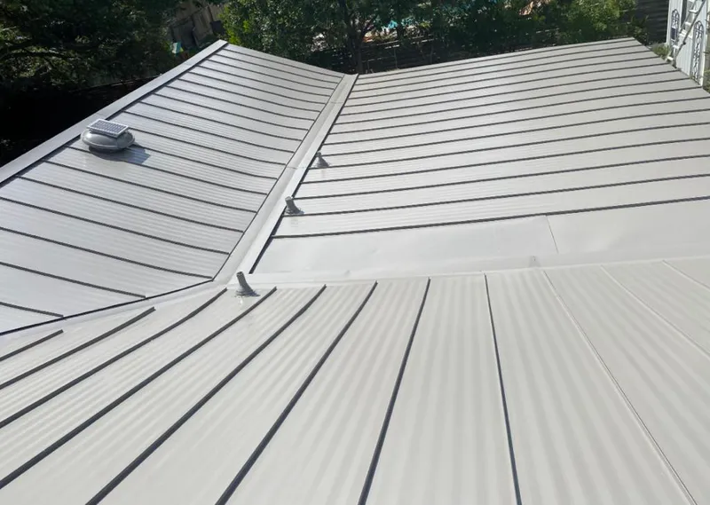 Solar attic fan installed on a metal roof for Roof Ventilation in South Lakes